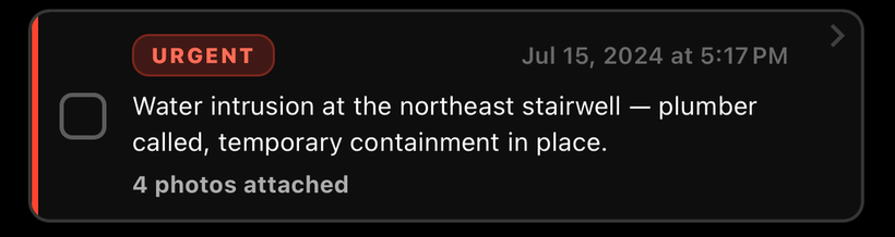 The urgent log card enlarged to reading size: 'Water intrusion at the northeast stairwell — plumber called, temporary containment in place. 4 photos attached.'
